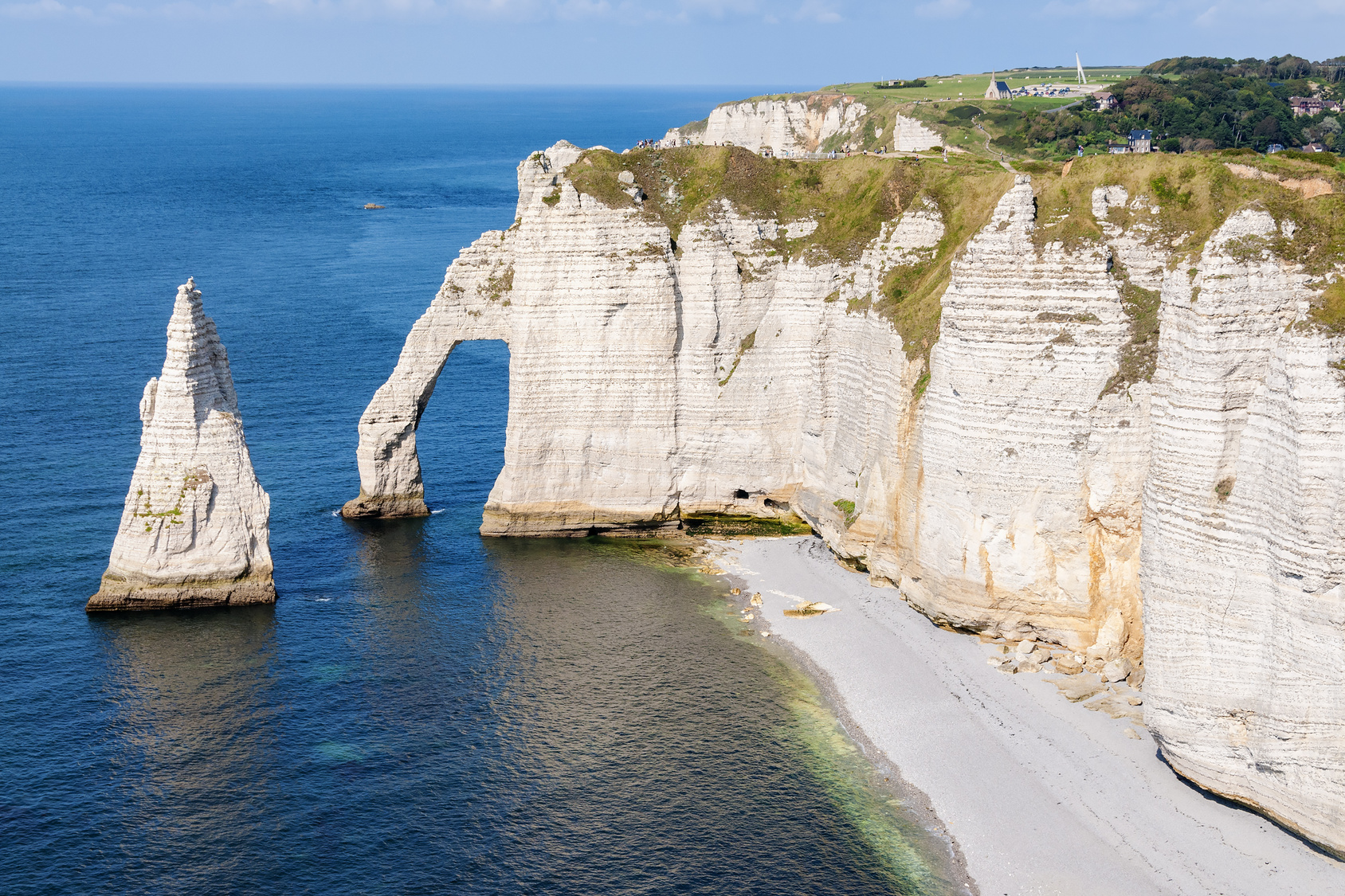 Alabaster coast of Normandy with rocks, sea and blue sky in France